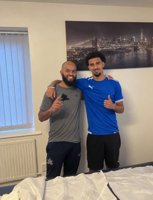 Ali with a professional footballer after a treatment session